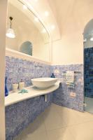 a bathroom with a sink and a mirror at Casa Mulini in Positano