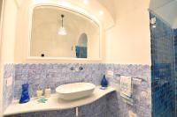 a bathroom with a sink and a mirror at Casa Mulini in Positano