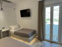 Posteľ alebo postele v izbe v ubytovaní Aphrodite Hotel & Apartments