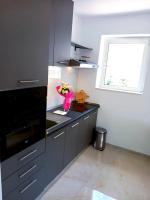 Kuchyň nebo kuchyňský kout v ubytování Apartmani kike