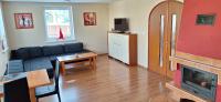 Televízia a/alebo spoločenská miestnosť v ubytovaní Apartmány Riviéra a Chalupa Riviéra Liptov, Bešeňová
