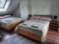Postel nebo postele na pokoji v ubytování Komandorska Apartments