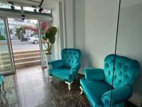 A seating area at Olimpos Beach Hotel by RRH&R