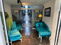 A seating area at Olimpos Beach Hotel by RRH&R