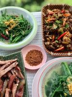 a table topped with plates of food and bowls of food at Doichang view in Ban Huai Khai