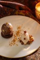 a white plate with a chocolate dessert on it at Palais Ronsard Relais & Chateaux in Marrakech