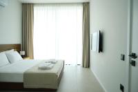 Postel nebo postele na pokoji v ubytování Ashta Suites - Cozy Suite