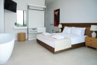 Postel nebo postele na pokoji v ubytování Ashta Suites - Cozy Suite