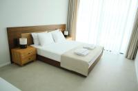 Postel nebo postele na pokoji v ubytování Ashta Suites - Cozy Suite