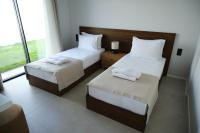 Postel nebo postele na pokoji v ubytování Ashta Suites - Cozy Suite