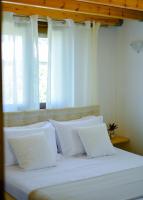 Posteľ alebo postele v izbe v ubytovaní Aura Skiathos
