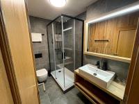 Koupelna v ubytování Wellness Hotel Grand