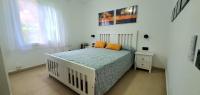 A bed or beds in a room at Las Golondrinas - RISSAGA
