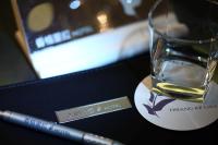 a cigarette and a glass of water on a table at Hsiangkelira Hotel in Kaohsiung