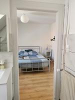 Posteľ alebo postele v izbe v ubytovaní 2e étage appartement entier 3 pièces idéal 2 personnes, 2 chambres communiquantes en enfilade, WIFI, espace travail parking gratuit