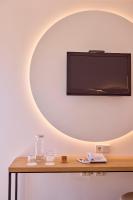 Telewizja i/lub zestaw kina domowego w obiekcie Universal Hotel Bikini