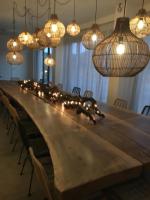 a long table with lights on top of it at Torres De Selma - Eco Resort in El Pla de Manlleu