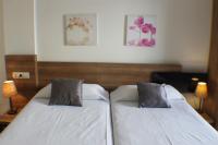 A bed or beds in a room at Agi Riera Ginjolers