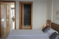 A bed or beds in a room at Agi Riera Ginjolers