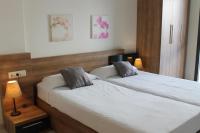 A bed or beds in a room at Agi Riera Ginjolers