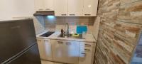 Kuchyňa alebo kuchynka v ubytovaní dimitris' villas - villa 1