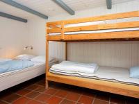 Postel nebo postele na pokoji v ubytování 14 person holiday home in Ulfborg