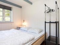 Postel nebo postele na pokoji v ubytování 14 person holiday home in Ulfborg
