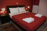 A bed or beds in a room at Xenonas Ioanni Parcha