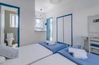 A bed or beds in a room at Sunflower Apartments & Studios
