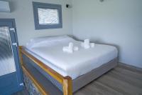 A bed or beds in a room at Ktima Faki, Olympus Mountain Accommodation & Retreat