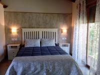 Postel nebo postele na pokoji v ubytování Hotel Rural La Covacha