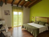 Postel nebo postele na pokoji v ubytování Hotel Rural La Covacha