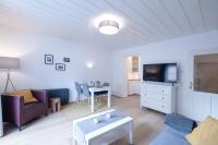 Televízia a/alebo spoločenská miestnosť v ubytovaní Gregor's Sonnenapartment