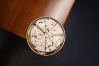 un tazón de comida sentado sobre una mesa en Hotel Monopoly, en Peshkopi