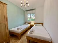 Posteľ alebo postele v izbe v ubytovaní Elimann ground floor seaside by HLCLUB Agency