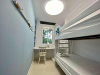 Posteľ alebo postele v izbe v ubytovaní Elimann ground floor seaside by HLCLUB Agency