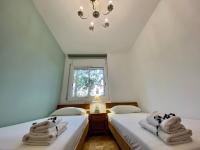 Posteľ alebo postele v izbe v ubytovaní Elimann ground floor seaside by HLCLUB Agency