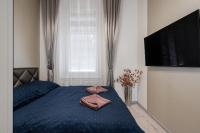 A bed or beds in a room at Király 35 Luxury Apartment with free parking