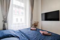 A bed or beds in a room at Király 35 Luxury Apartment with free parking