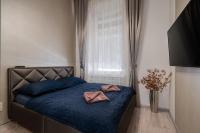 A bed or beds in a room at Király 35 Luxury Apartment with free parking