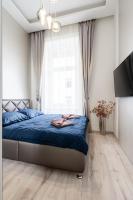 A bed or beds in a room at Király 35 Luxury Apartment with free parking