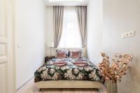 A bed or beds in a room at Király 35 Luxury Apartment with free parking
