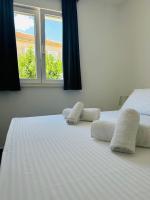 Posteľ alebo postele v izbe v ubytovaní Vila Zrina - Apartmani