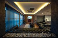 A television and/or entertainment centre at Alfa Suites & SPA