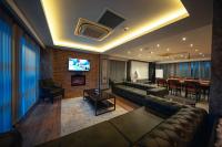 A television and/or entertainment centre at Alfa Suites & SPA