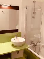 a bathroom with a sink and a shower at Terres de France - Résidence Côté Provence in Gréoux-les-Bains