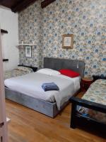 A bed or beds in a room at B&B VILLA LUPIDI