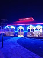 a building with purple and blue lights on it at Kutch Leela Resort in Mandvi