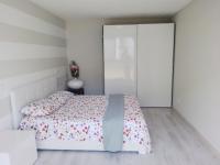 A bed or beds in a room at HOLIDAY APARTAMENTS