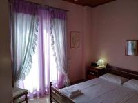 Postel nebo postele na pokoji v ubytování Aggelos House in Kalamitsi